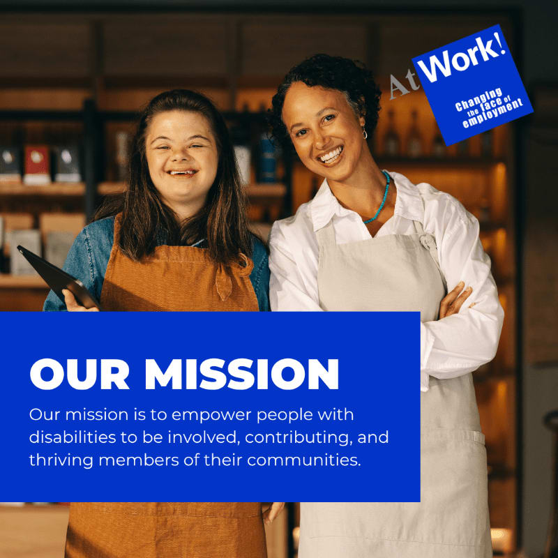 Two smiling women, one with Down syndrome, stand in an apron in front of shelves of products, with a blue banner at the bottom stating "OUR MISSION" and a blue square in the upper right corner with "At Work!" and "Changing the face of employment."