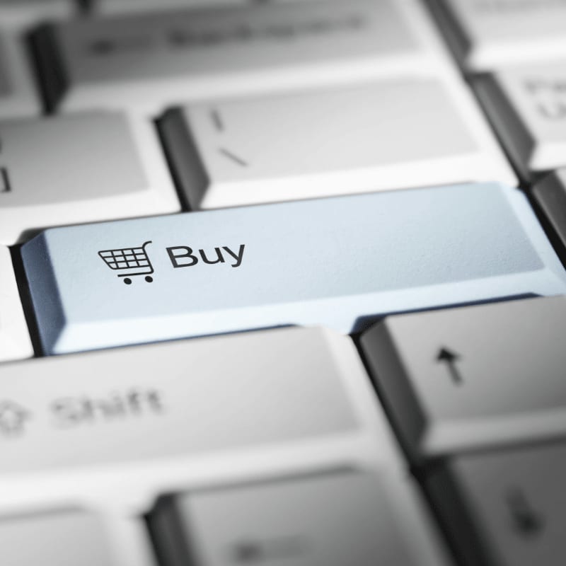 Close-up of a keyboard with a prominent 'buy' button