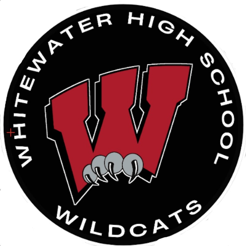 A large red "W" with claw marks in the foreground is set against a black circular background with white text reading "WHITEWATER HIGH SCHOOL WILDCATS" around the perimeter.