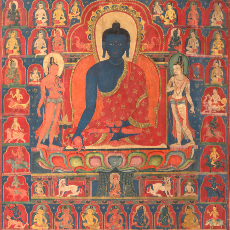 A central blue Buddha sits cross-legged on a lotus throne, flanked by two figures, all surrounded by a grid of smaller deities and figures.