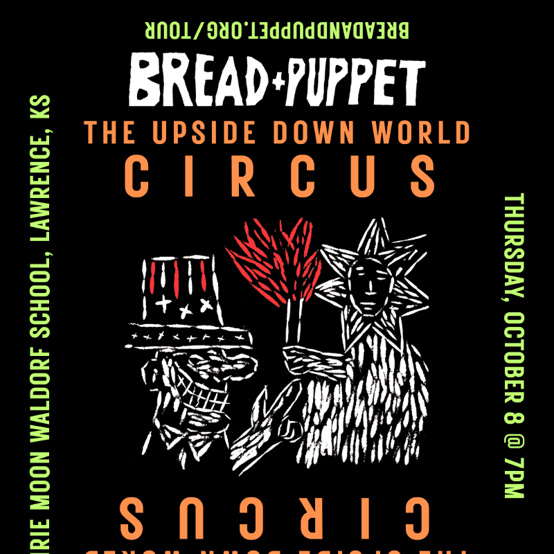A black poster advertises "Bread + Puppet: The Upside Down World Circus" with a white illustration of two figures in the foreground and event details in the background.