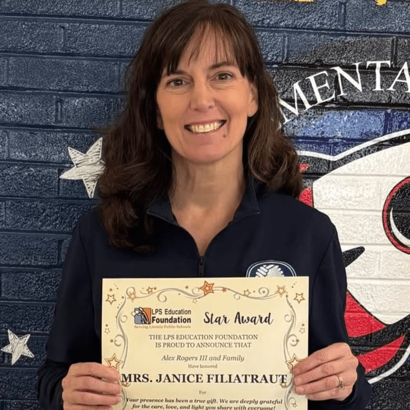 A smiling woman in the foreground holds a "Star Award" certificate, while a colorful mural of a rocket and stars adorns the background.