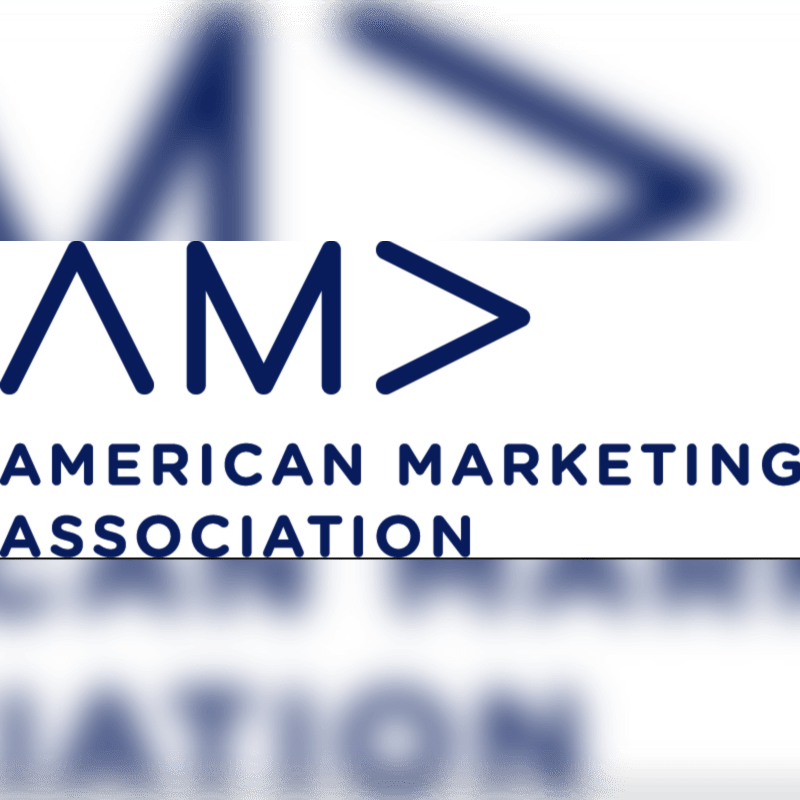A blue and white logo for the American Marketing Association is in the foreground, with a blurred blue abstract shape in the background.