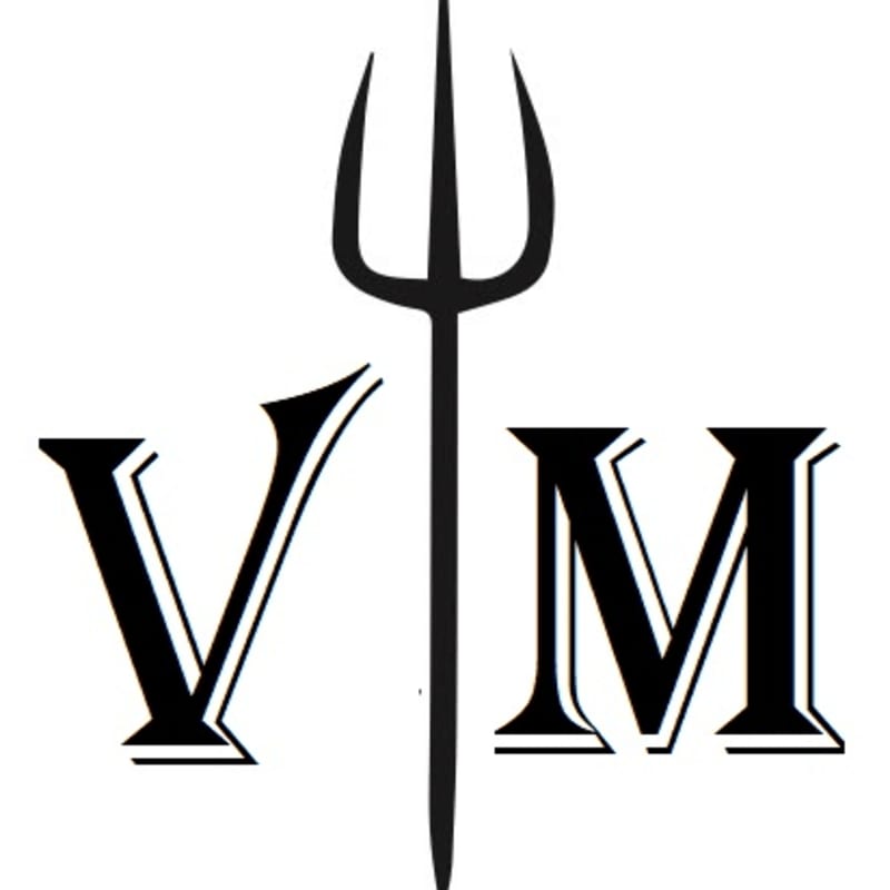 A black trident stands vertically behind the letters "V" and "M" which are in the foreground against a white background.