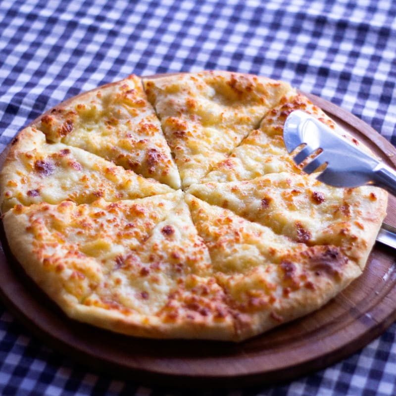 pizza on brown wooden tray