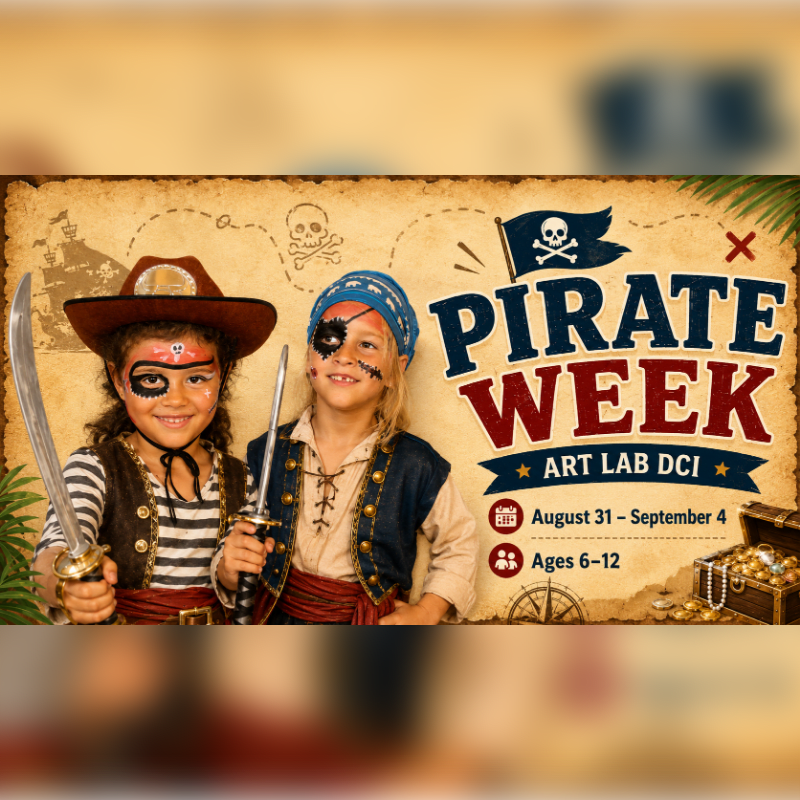 Two children dressed as pirates with face paint and swords stand in front of a "Pirate Week" banner with a treasure chest in the background.