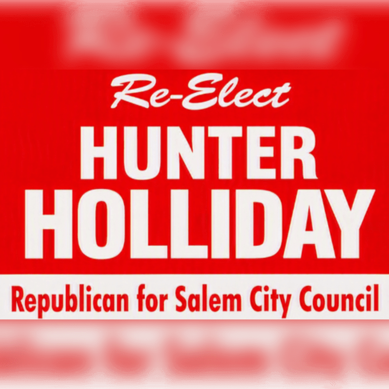 A red and white political campaign sign for "Re-Elect Hunter Holliday, Republican for Salem City Council" is blurred in the background.