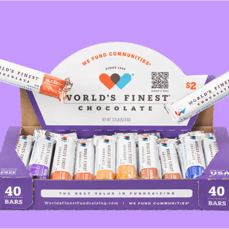 In the foreground, a box of World's Finest Chocolate bars is displayed, while the background is a solid purple color.