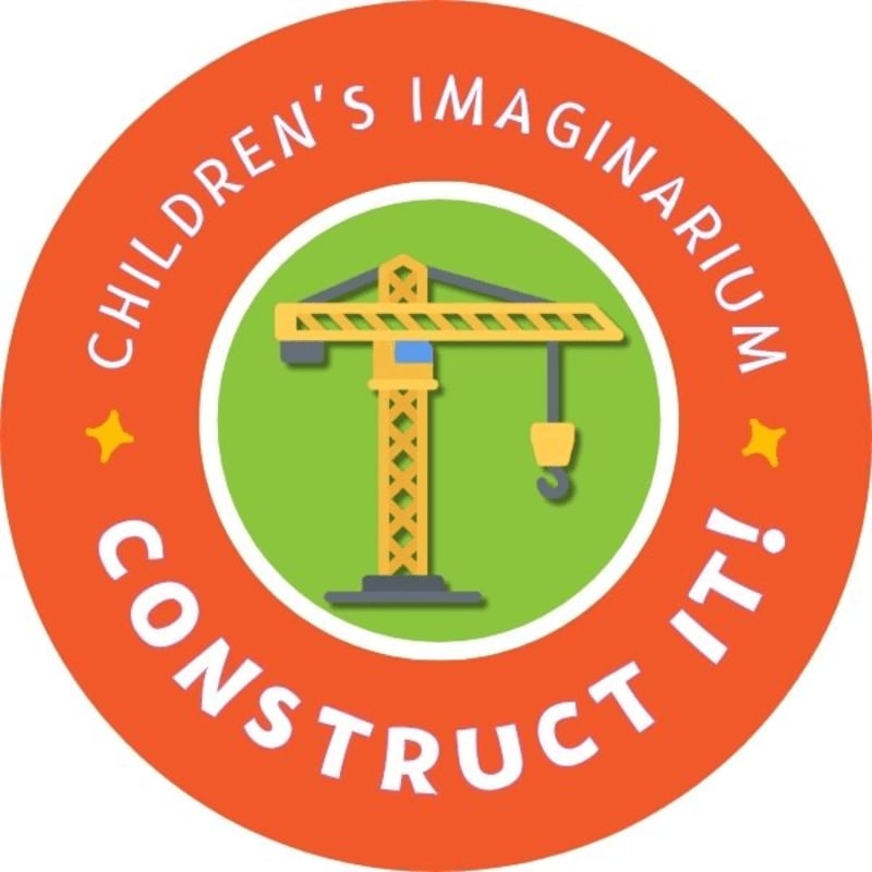 A yellow construction crane stands in front of a green background, all within an orange circular emblem that reads "CHILDREN'S IMAGINARIUM CONSTRUCT IT!".