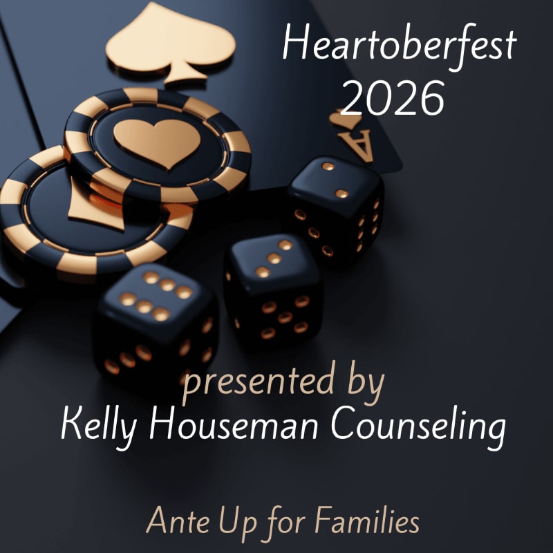 Black dice and gold-rimmed poker chips with a spade symbol are in the foreground, while the background features a spade card and text reading "Heartoberfest 2026 presented by Kelly Houseman Counseling Ante Up for Families."