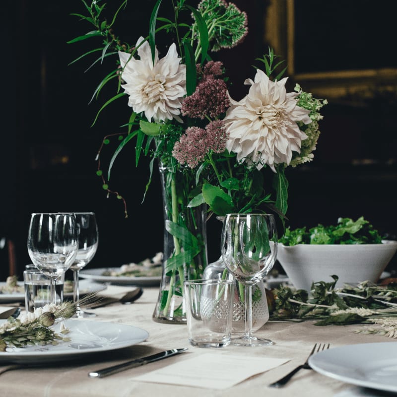 white and brown flowers on white table