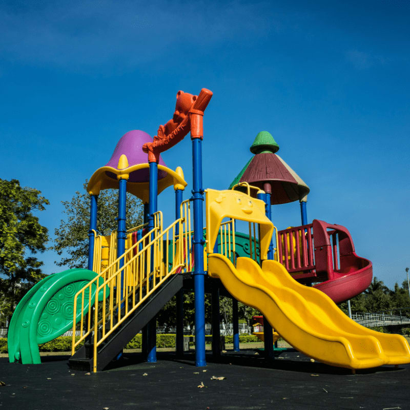 multicolored playground slide during daytime
