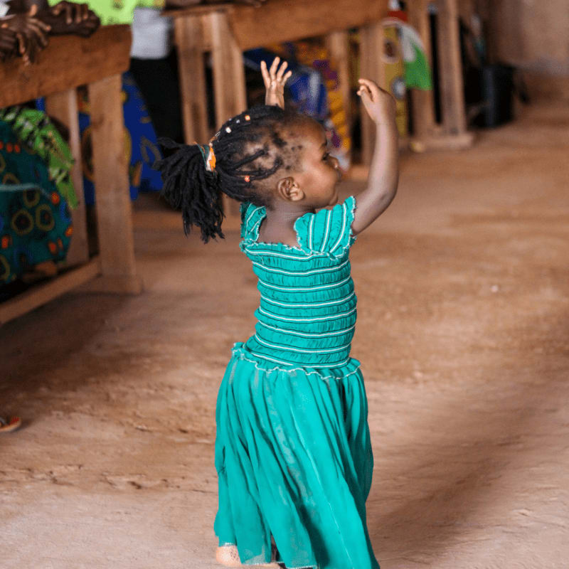 people watching dancing girl wearing blue dress