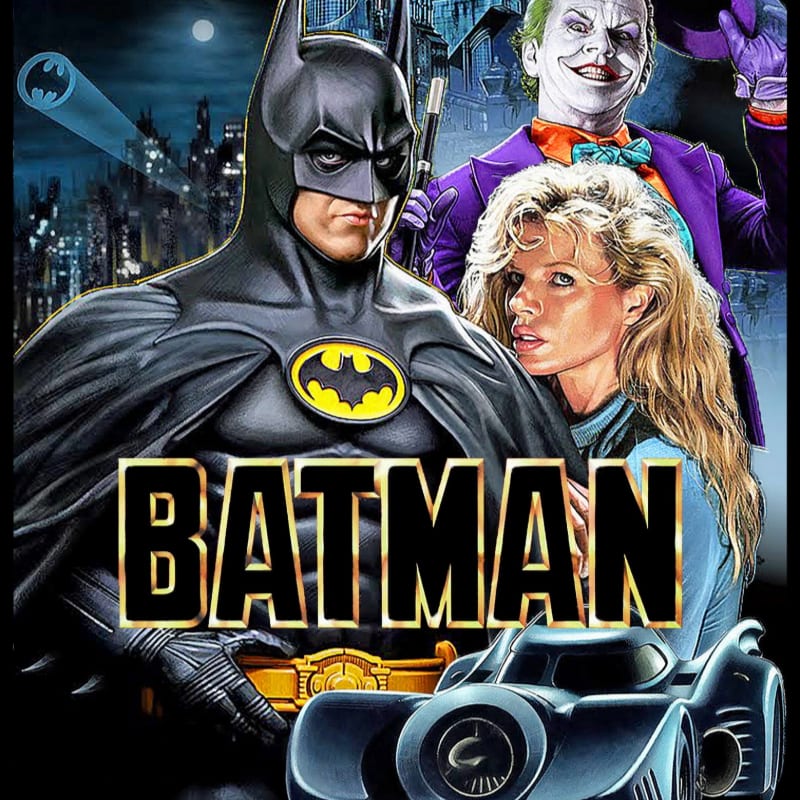 Batman stands prominently in the foreground with the Batmobile below, while the Joker and Vicki Vale are positioned behind him against a dark, urban cityscape.