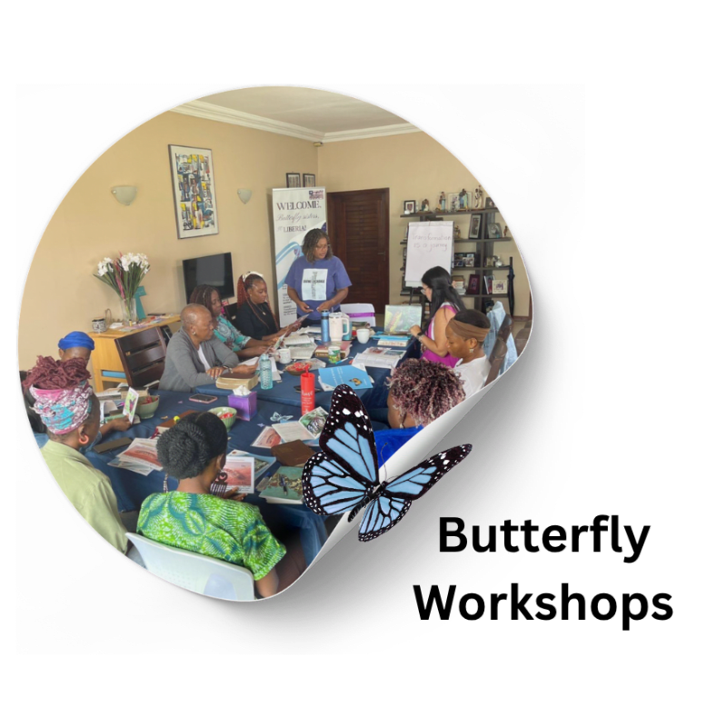 A group of people are gathered around a table in a room with a butterfly overlaying the foreground and "Butterfly Workshops" text in the background.