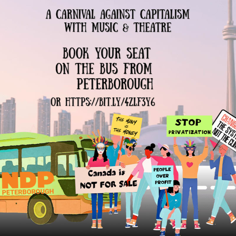 A green NDP bus is parked in front of a city skyline, with a group of people holding protest signs.