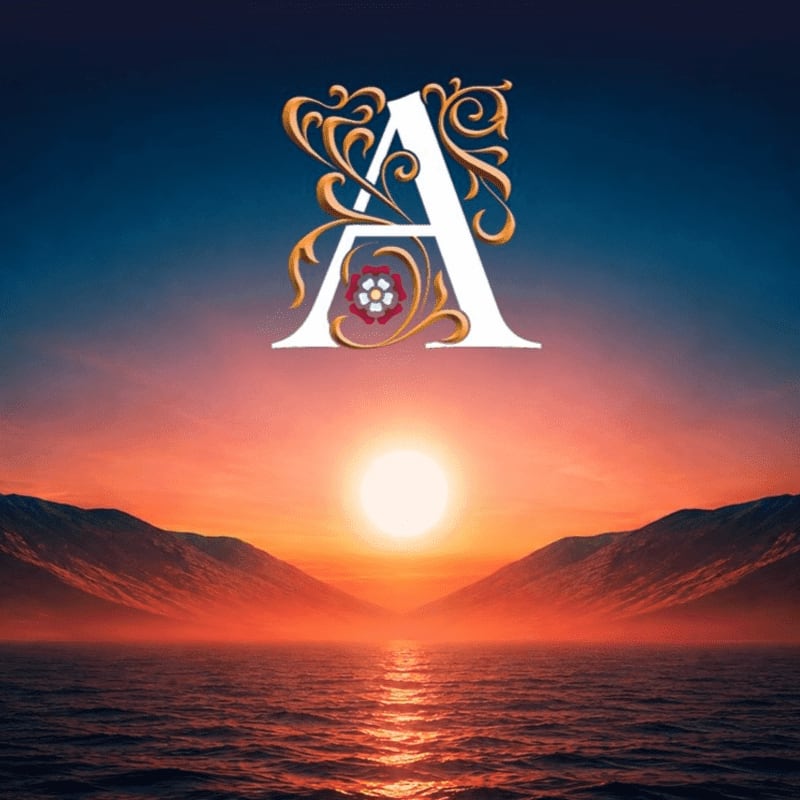 A large, ornate letter "A" with floral embellishments hovers above a serene ocean reflecting a vibrant sunset between silhouetted mountains.