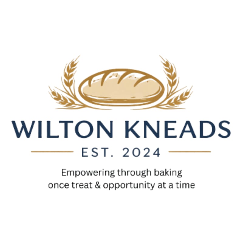 A loaf of bread with wheat stalks frames the text "WILTON KNEADS EST. 2024 Empowering through baking once treat & opportunity at a time" against a white background.
