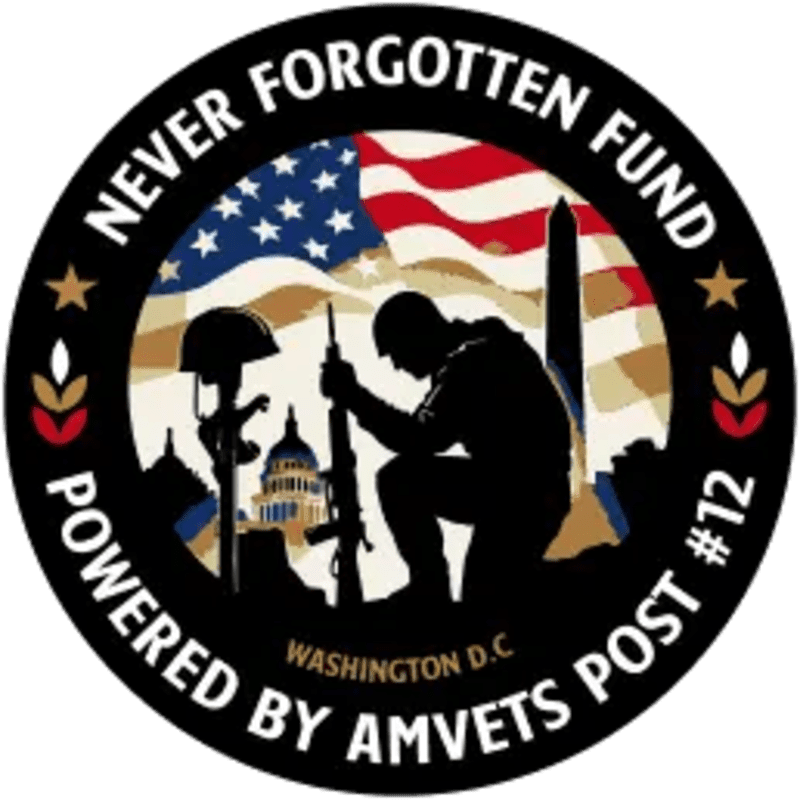 A silhouette of a kneeling soldier with a rifle and a helmet on a cross in the foreground is set against a background of the Washington Monument, the Capitol building, and a waving American flag, all within a circular emblem that reads "NEVER FORGOTTEN FUND POWERED BY AMVETS POST #12 WASHINGTON D.C."