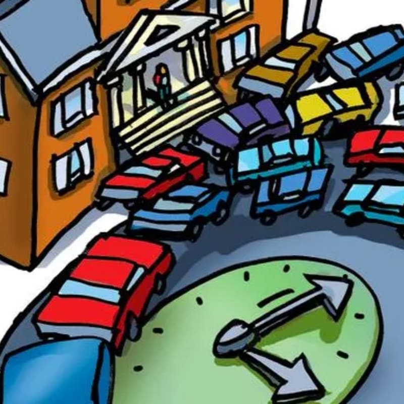 A large clock face with arrows in the foreground is surrounded by a street filled with colorful cars, leading to a building with a grand entrance in the background.