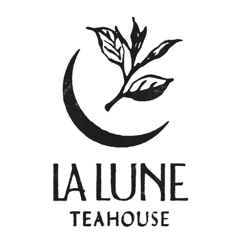 A black and white logo features a crescent moon and a sprig of leaves in the foreground, with the words "LA LUNE TEAHOUSE" in block letters below.