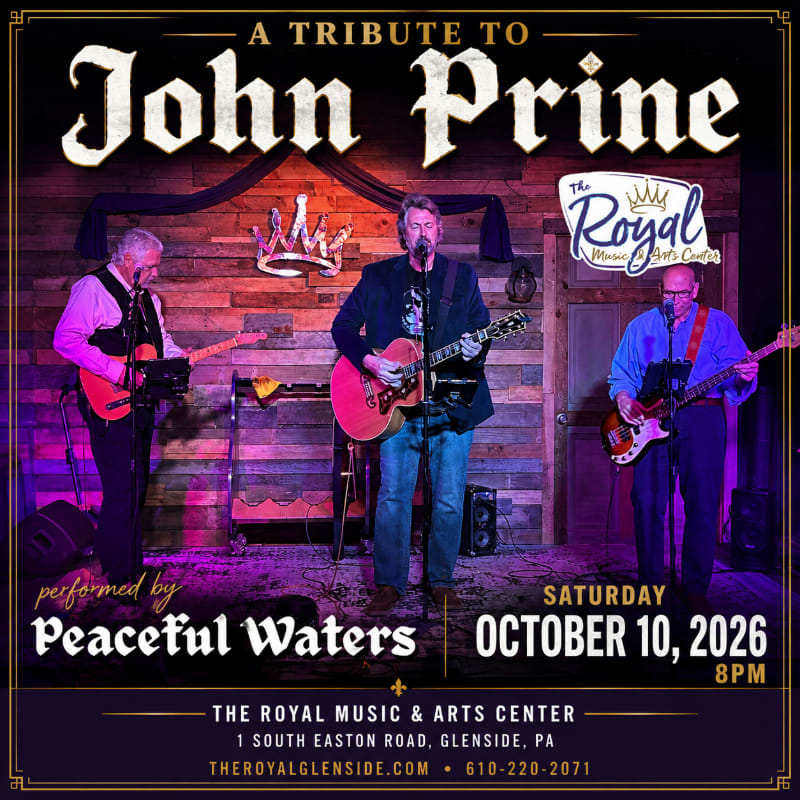 Three musicians perform on a stage with a rustic wooden backdrop, advertising a tribute to John Prine at The Royal Music & Arts Center.