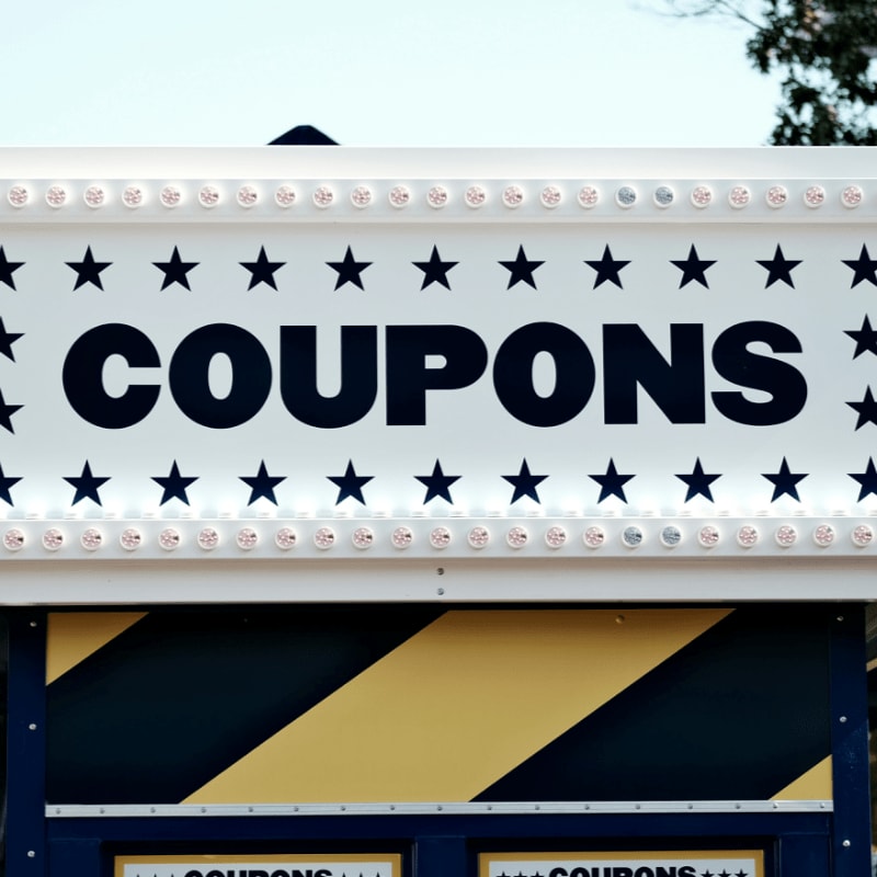 a sign that says coupons on it