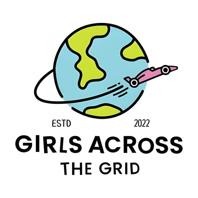 A pink race car orbits a cartoon Earth with "GIRLS ACROSS THE GRID ESTD 2022" written below.