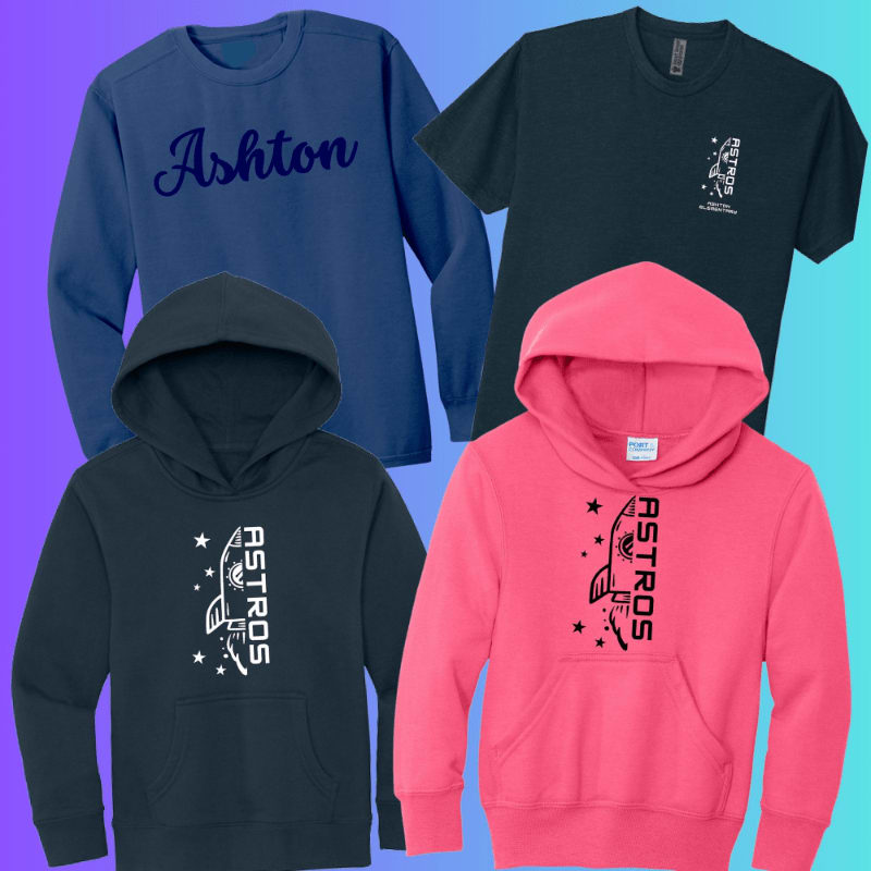 Four pieces of apparel, a blue long-sleeved shirt with "Ashton" in cursive, a dark teal t-shirt with a rocket graphic, a dark teal hoodie with a rocket and stars, and a pink hoodie with a rocket and stars, are arranged against a gradient background.