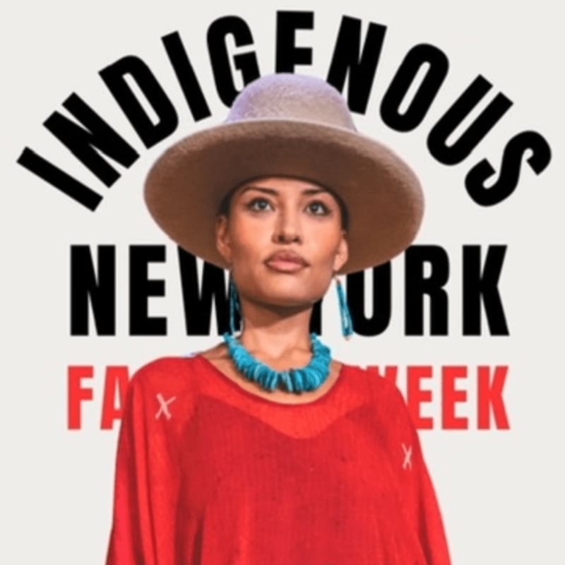 A woman in a wide-brimmed hat and red top stands before a background with "INDIGENOUS NEW YORK FASHION WEEK" text.