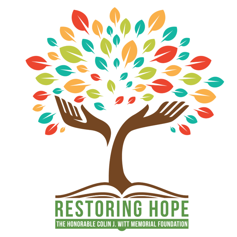 Two open hands form the trunk of a colorful tree with many leaves, resting on an open book with the words "RESTORING HOPE THE HONORABLE COLIN J. WITT MEMORIAL FOUNDATION" below it, all against a white background.