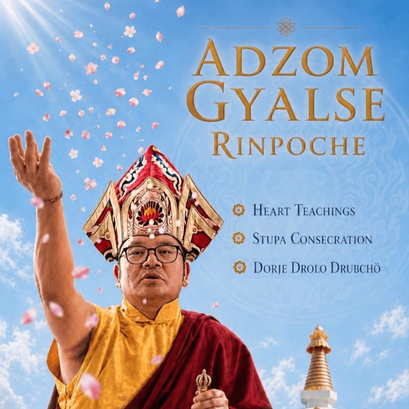 A man in ornate religious attire with his arm raised, showering petals, stands against a bright sky with a stupa in the background.