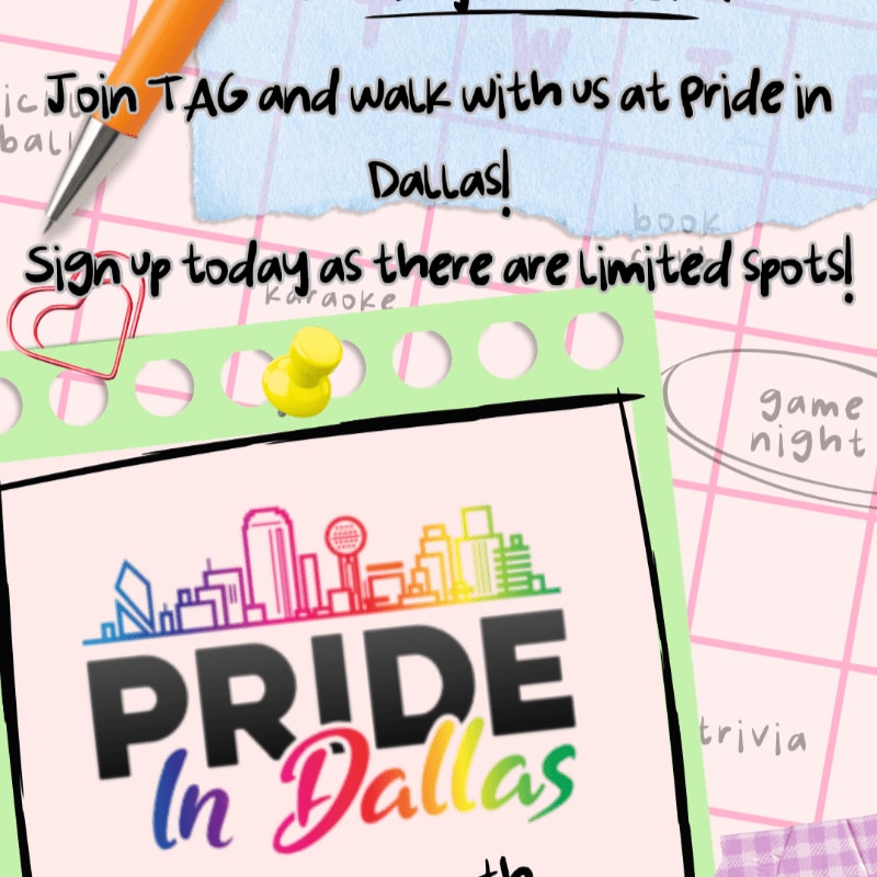 A bright orange pen rests on a pink background with a "Pride in Dallas" logo and event details in the foreground, while a blurred background shows a grid pattern and handwritten notes.