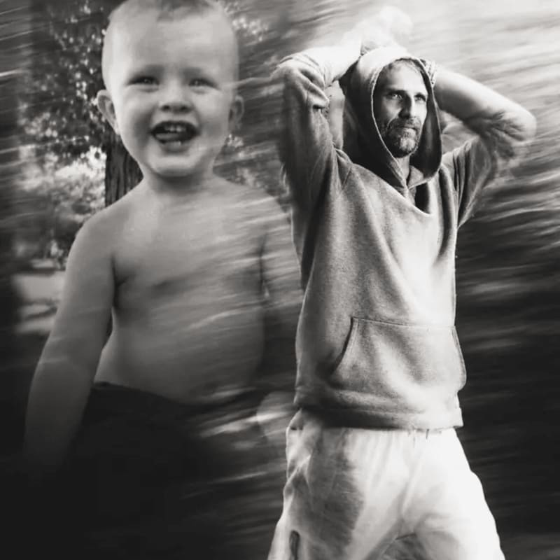 A smiling toddler is superimposed over a man in a hoodie, both appearing in motion against a blurred outdoor background.