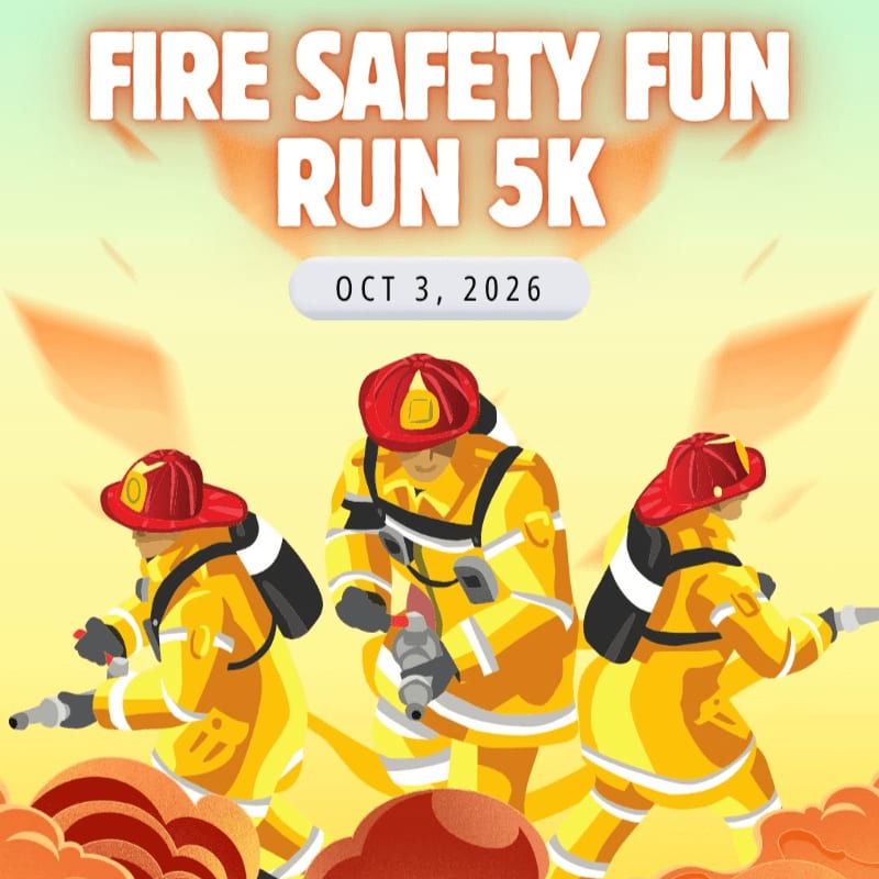 Three firefighters in yellow gear are running in the foreground against a bright orange and yellow background with the text "FIRE SAFETY FUN RUN 5K" and "OCT 3, 2026" at the top.