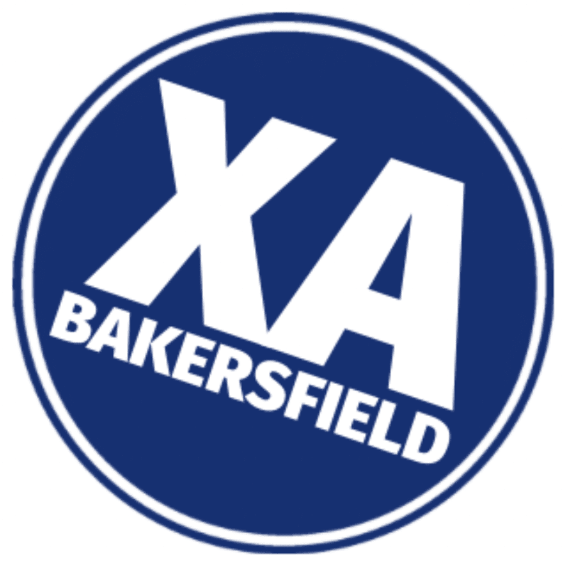 White letters "XA" and "BAKERSFIELD" are displayed diagonally on a dark blue circular background.