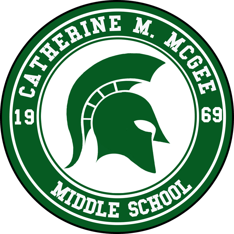 A green Spartan helmet is centered within a circular emblem that reads "CATHERINE M. MCGEE MIDDLE SCHOOL" and "19 69" in white lettering against a dark green background.