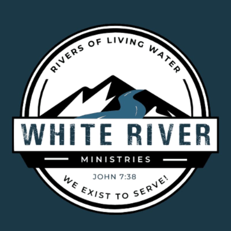 A stylized logo features a blue river flowing through snow-capped mountains in the foreground, set against a dark blue background.
