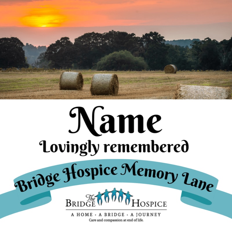 Two hay bales sit in a field in the foreground, with a sunset over rolling hills in the background, beneath text that reads "Name Lovingly remembered Bridge Hospice Memory Lane" and the Bridge Hospice logo.