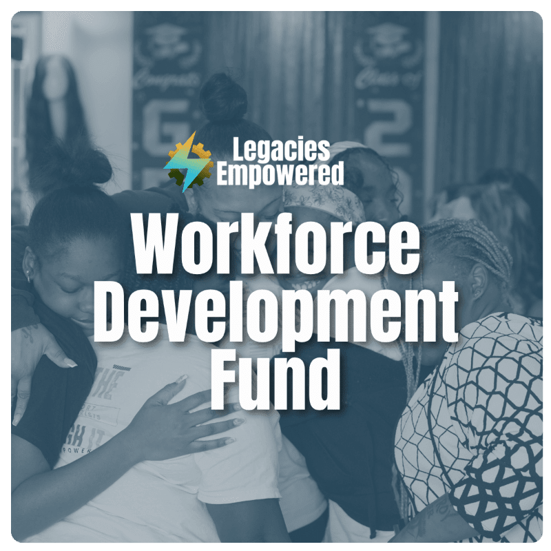 A group of people are embracing in the foreground, with the words "Legacies Empowered Workforce Development Fund" overlaid on the image, and a blurred background of what appears to be a room with some signage.