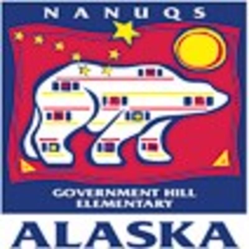 A stylized polar bear with colorful stripes and windows is in the foreground, set against a red background with a yellow star and sun, while "NANUQS GOVERNMENT HILL ELEMENTARY ALASKA" is written in the background.
