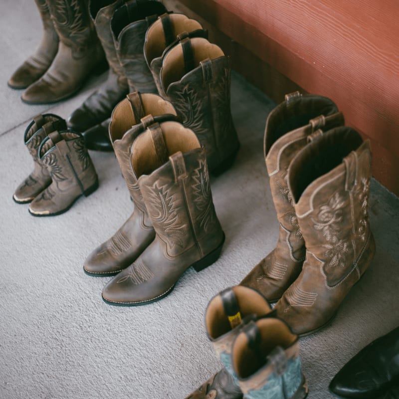 brown leather boots on gray carpet