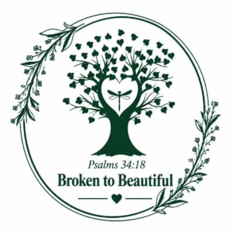 A circular wreath of greenery frames a stylized tree with heart-shaped leaves and a dragonfly at its center, beneath which the text "Psalms 34:18 Broken to Beautiful" is displayed.