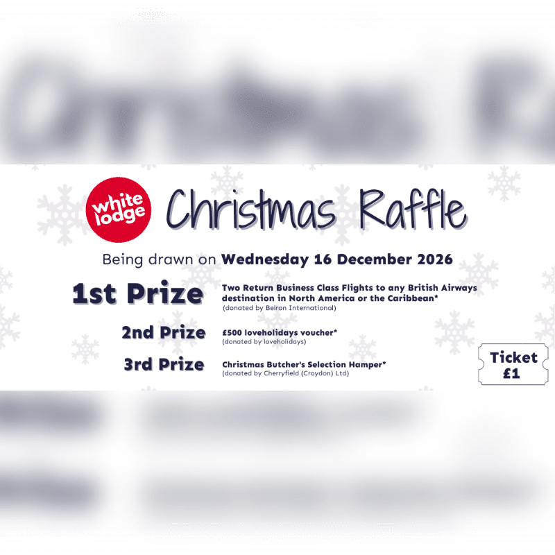 A white Christmas raffle poster with prize details in the foreground and a blurred festive background.