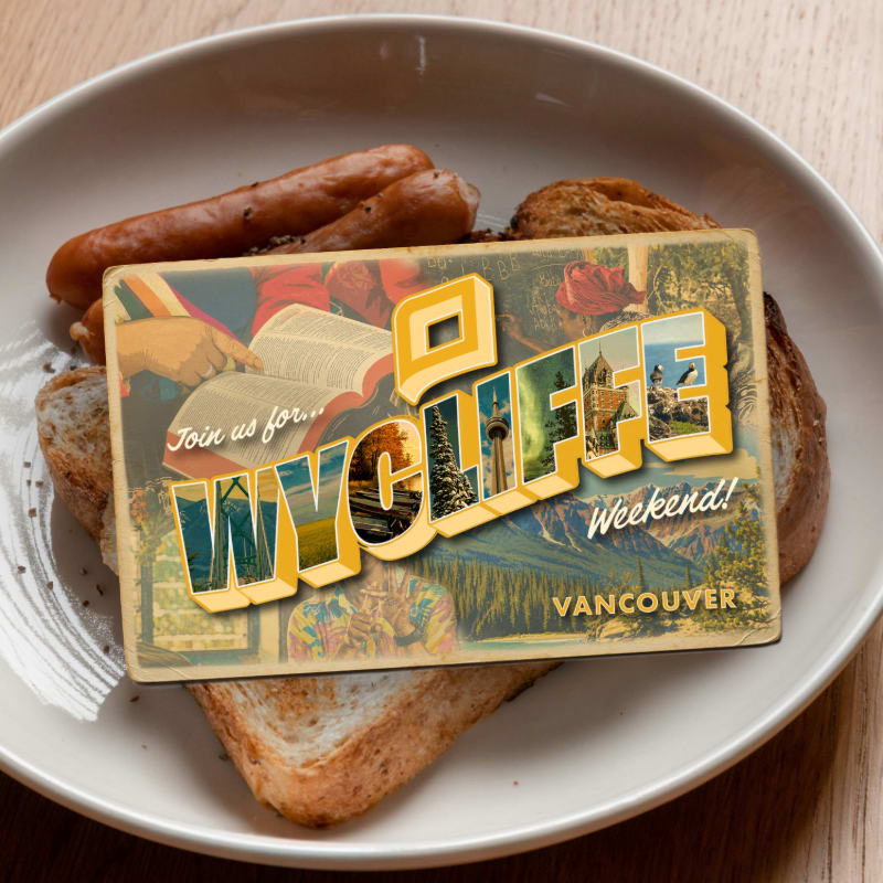 A postcard advertising "Wycliffe Weekend Vancouver" rests on a plate of toast and sausages.