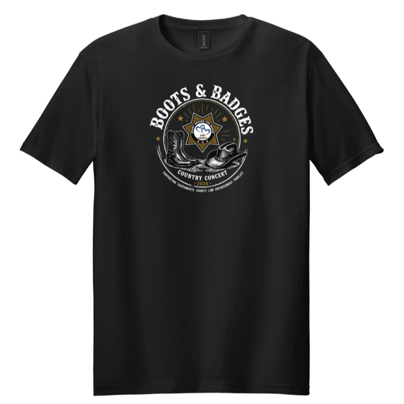A black t-shirt with a circular graphic featuring cowboy boots, a hat, and a sheriff's badge, set against a plain white background.