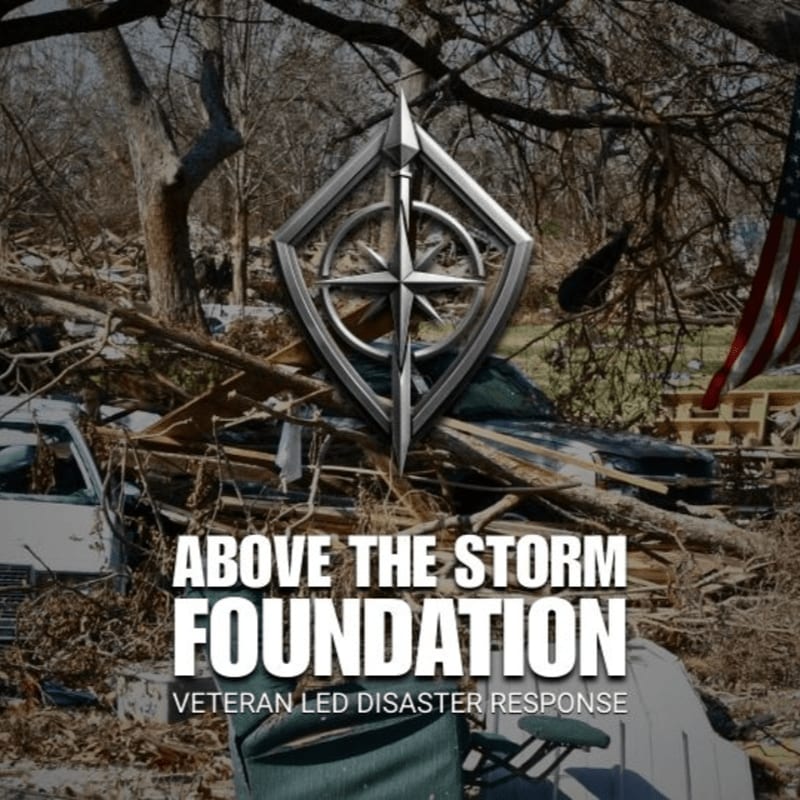 A metallic shield logo hovers over a scene of tornado debris, including a damaged car and an American flag, with the text "ABOVE THE STORM FOUNDATION" and "VETERAN LED DISASTER RESPONSE" below.