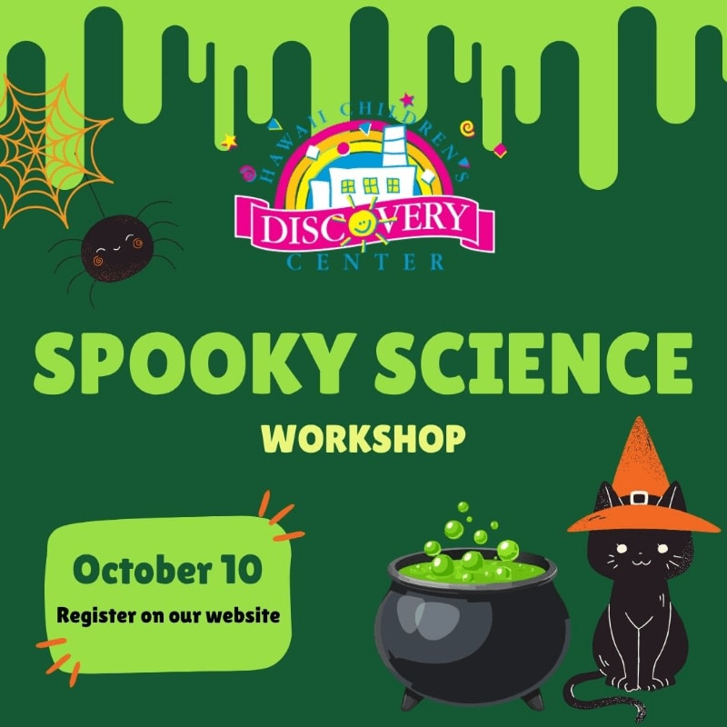 A black cat in an orange witch hat sits beside a bubbling cauldron in the foreground, while a spiderweb and a dripping slime border frame the "Spooky Science Workshop" announcement against a green background.