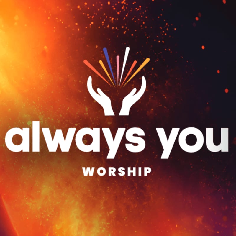 White text reading "always you WORSHIP" is centered in the foreground, with a logo of two cupped hands holding colorful sparks above it, set against a fiery, abstract background of orange and yellow hues.