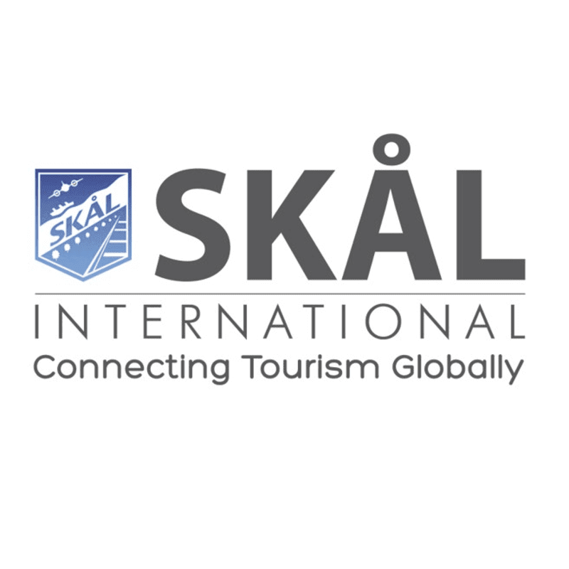 A shield with "SKÅL" and a stylized bridge is to the left of the large gray text "SKÅL", with "INTERNATIONAL" and "Connecting Tourism Globally" below it, all on a white background.